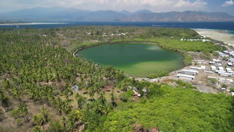 Aerial-of-saltwater-lake-at-Gili-Meno,-nestled-among-the-idyllic-Gili-Islands-of-Indonesia,-stands-as-a-serene-and-enchanting-paradise-for-travelers-seeking-an-escape-from-the-ordinary