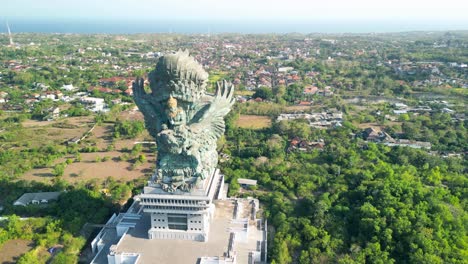 Aerial-of-Bali's-Patung-Garuda-Wisnu-Kencana,-awe-inspiring-statue-that-depicts-the-Hindu-god-Vishnu-riding-atop-the-mythical-bird-Garuda