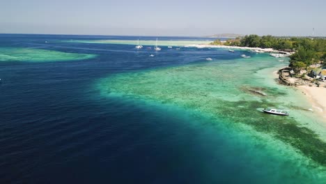 Fixed-aerial-of-Gili-Air-Beach-South,-idyllic-island-of-Gili-Air-in-Indonesia,-an-true-tropical-paradise-that-captures-the-essence-of-serene-island-life