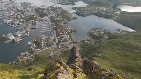 Revealing-aerial-shot-of-Svolvær-in-Lofoten,-Norway-from-mountain-top,-Fløya-and-Djevelporten-drone-footage