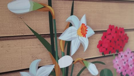 Interior-walls-of-a-building-have-been-decorated-with-vinyl-sticker-wall-art-to-create-a-garden-like-environment-in-an-old-peoples-care-home-with-pictures-of-daisy-flowers-on-the-wall-with-fake-wood