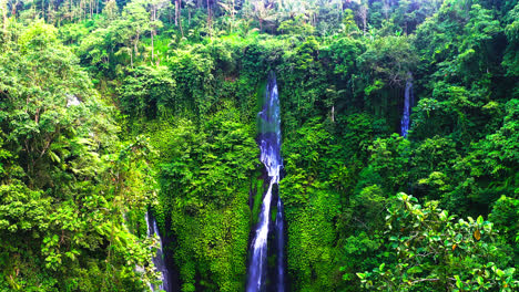 Fiji-waterfalls-cascading-down-on-overgrown-rainforest-cliff-to-pool
