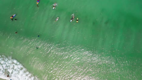 Aerial-Rotating-Top-View-over-Lombo-Selong-Belanak-Beach-in-Indonesia-with-Waves-and-Surfers