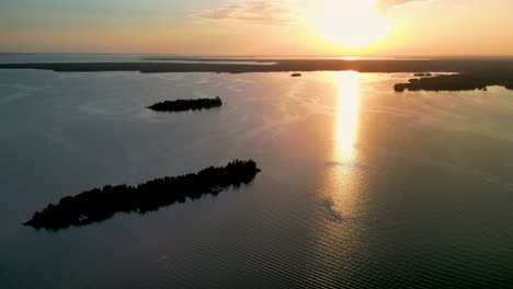 Aerial-view-of-islands-and-sunset-in-northern-peninsula,-Hessel,-Michigan