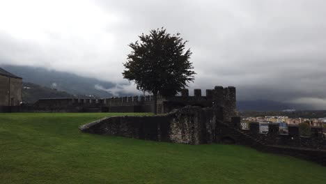 Panoramic-of-Unesco-City-Stone-Walls-of-Bellinzona-Castles,-Swiss-Alpine-Valley