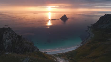 Norwegian-spectacular-nature-landscape-view,-drone-flyover-Andøya-island-capturing-coastal-Måtind-mountains-cape-at-sunset-golden-hours