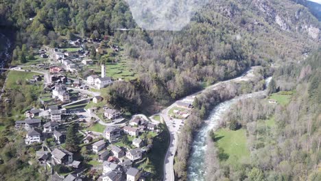 POV-Inside-Cableway-Crossing-the-Swiss-Alps-Valley-in-Braggio-Village,-Grisons-Canton