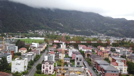 Aerial-View-Above-Bellinzona-Swiss-Town-in-Ticino-Canton-Switzerland-Alps-Valley