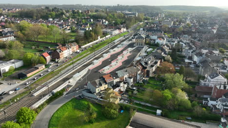 Wavre-City-Train-Station-Aerial-Approach,-Sunny-Morning
