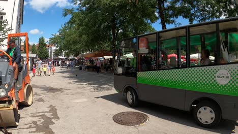 Passing-by-a-local-fruit-market-in-a-Ljubljana-square-on-a-sunny-day