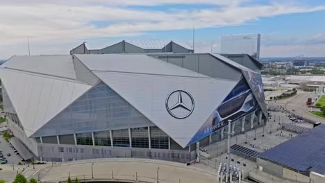 Aerial-rising-shot-of-Mercedes-Benz-Stadium-in-Atlanta-City-at-sunny-day-outdoors