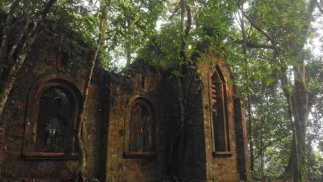 Flying-backwards-at-Ruins-Of-Bavi-French-Church-In-The-National-Park,-Vietnam