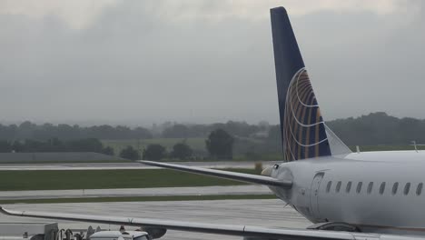 Exhaust-Fumes-Seen-From-Tail-Cone-Of-United-Airline-Plane-On-Tarmac