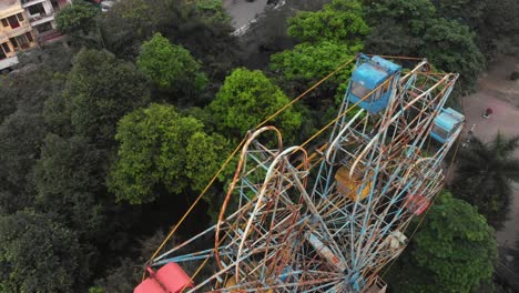 An-overhead-perspective-of-Hanoi's-abandoned-Ferris-wheel,-aerial