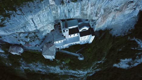 Drone-view-tilting-upward-of-the-Madonna-Della-Corona-in-northern-Italy