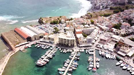 Yacht-pier-and-downtown-of-Chania-city,-aerial-view