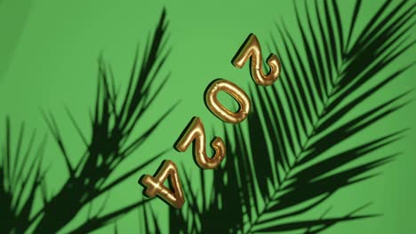 Golden-ballon-2024-on-Silhouetted-Palms-green-background-vertical