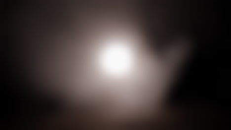 Strange,-glowing,-alien,-UFO-orb-light,-ghost-or-moon-light-with-smoke-and-fog-for-halloween-or-science-fiction,-sci-fi-background