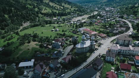 beautiful-aerial-of-a-Romanian-town-in-a-deep-mountain-valley
