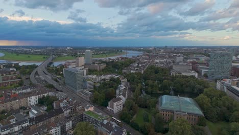 Aerial-view-of-the-Düsseldorf-cityscape-on-a-blue,-cloudy-evening-sky