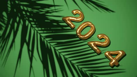 Golden-ballon-2024-on-Silhouetted-Palms-green--background