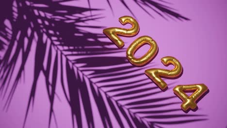 Golden-ballon-2024-on-Silhouetted-Palms-pink-background