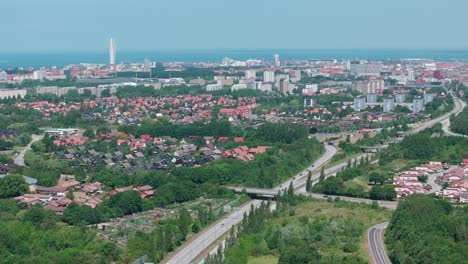Suburb-residential-area-in-Malmö,-Sweden,-city-skyline-aerial-forward