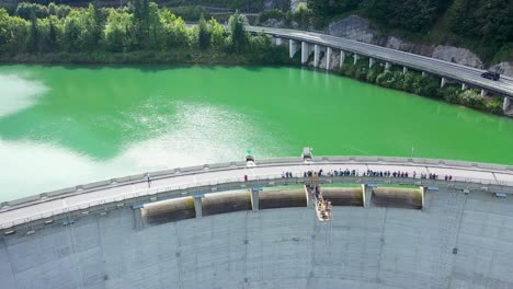 Viewers-on-bridge-watching-people-bungee-jumping-off-a-high-dam-platform-in-Austria
