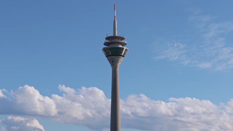Aerial-view-of-the-Rhine-Tower-against-a-clear-blue-sky-in-Düsseldorf