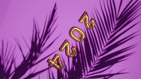 Golden-ballon-2024-on-Silhouetted-Palms-pink-background-vertical