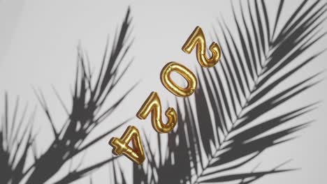 Golden-ballon-2024-on-Silhouetted-Palms-white-background-vertical