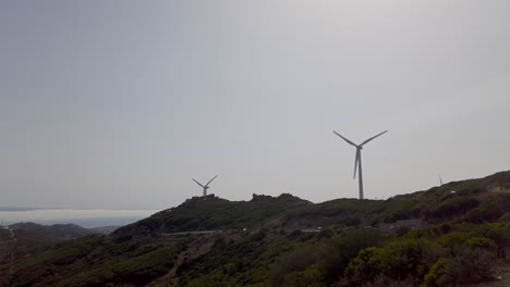 Wind-Turbines-And-Highway-On-The-Coastline-Of-Tarifa-In-Cadiz,-Spain