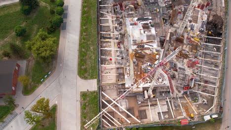 Aerial-of-a-large-construction-site-with-cranes-in-Gdansk,-Poland