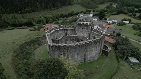 Aerial-circling-Moeche-Castle,-Galicia,-Spain
