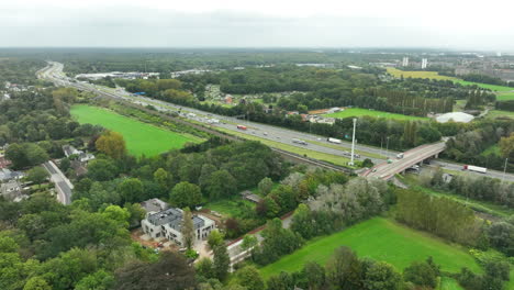 Traffic-on-E19-Highway-on-an-Overcast-Day-AERIAL-DOLLY-IN