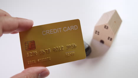 CLose-up-of-a-mockup-credit-card-that-could-be-used-for-financing-a-car-or-a-housing-loan-to-acquire-some-personal-assets