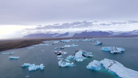 Epic-drone-flight-above-ice-chunks-in-arctic-region-at-daytime