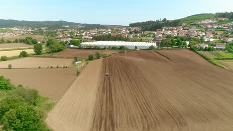 Aerial-View-Of-Rural-Field-And-Tractor