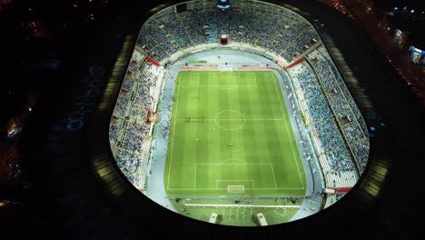 Peru's-National-Stadium-at-night,-Copa-Peru-Sports-betting-Arena-at-night-with-a-footbal-game-being-played-in-Lima
