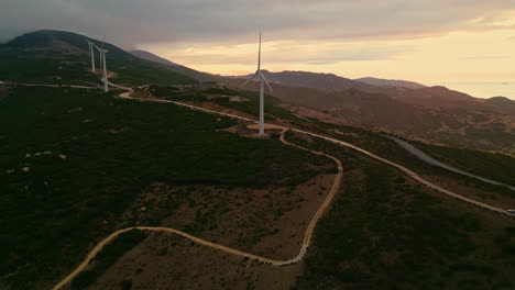 Aerial-drone-view-of-a-wind-power-station-at-sunset-in-Tarifa,-Spain