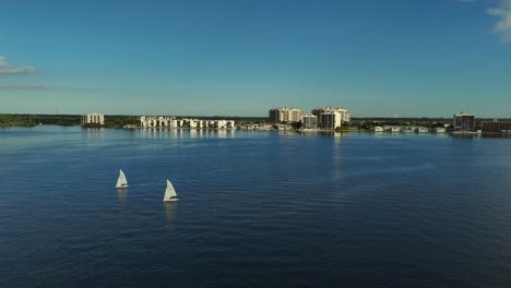 Aerial-pan-view-of-small-sailboaters