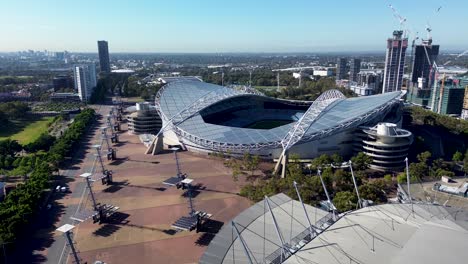 Drone-aerial-view-Sydney-Olympic-Park-Accor-sports-live-stadium-arena-football-nrl-concert-entertainment-venue-buildings-cranes-park-show-ground-Homebush-Bay-NSW-West-Sydney-Australia-4K