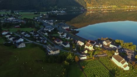 Aerial-over-the-waterfront-of-Syvde,-Vanylven-Municipality,-Norway