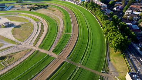 Drone-aerial-view-of-Royal-Randwick-Racecourse-races-horse-racing-sport-grass-field-track-gambling-fencing-path-course-NSW-Randwick-Coogee-Sydney-City-Australia-4K