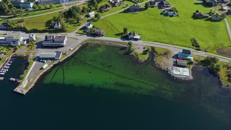 Aerial-over-the-waterfront-of-Syvde,-Vanylven-Municipality,-Norway