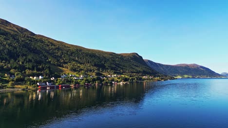 Aerial-over-Syvde-waterfront-on-a-lovely-sunny-day,-Vanylven-Municipality,-Norway