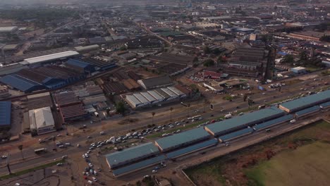 Drone-Video-of-Mbare-High-Density-Suburb-Township-Warehouses-In-Harare,-Zimbabwe