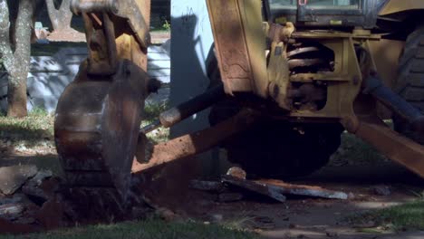 Heavy-industrial-machinery-operating-at-city-construction-site,-slo-mo