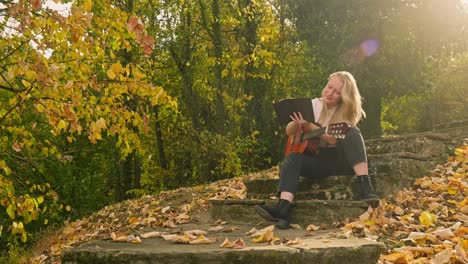 Happy-songwriter-musician-autumn-woodland-golden-sunshine-inspiration