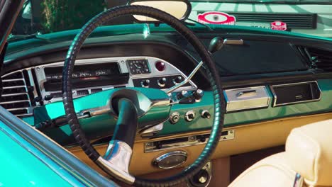 Dashboard-and-steering-wheel-of-a-Citroën-DS-Pallas-put-on-show-during-a-classic-car-meeting-in-Bozen---Bolzano,-Italy